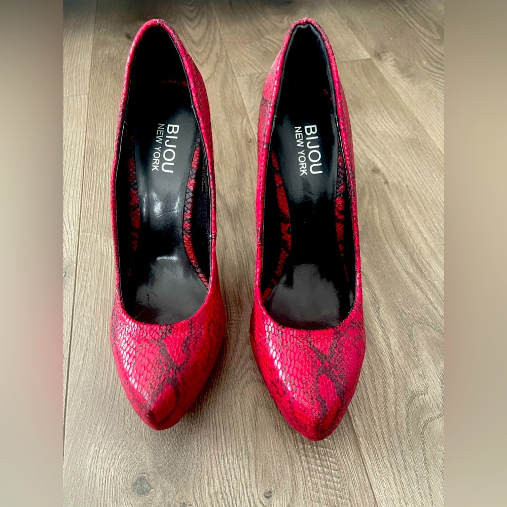 Fun red snakeskin heel. Size 8.5